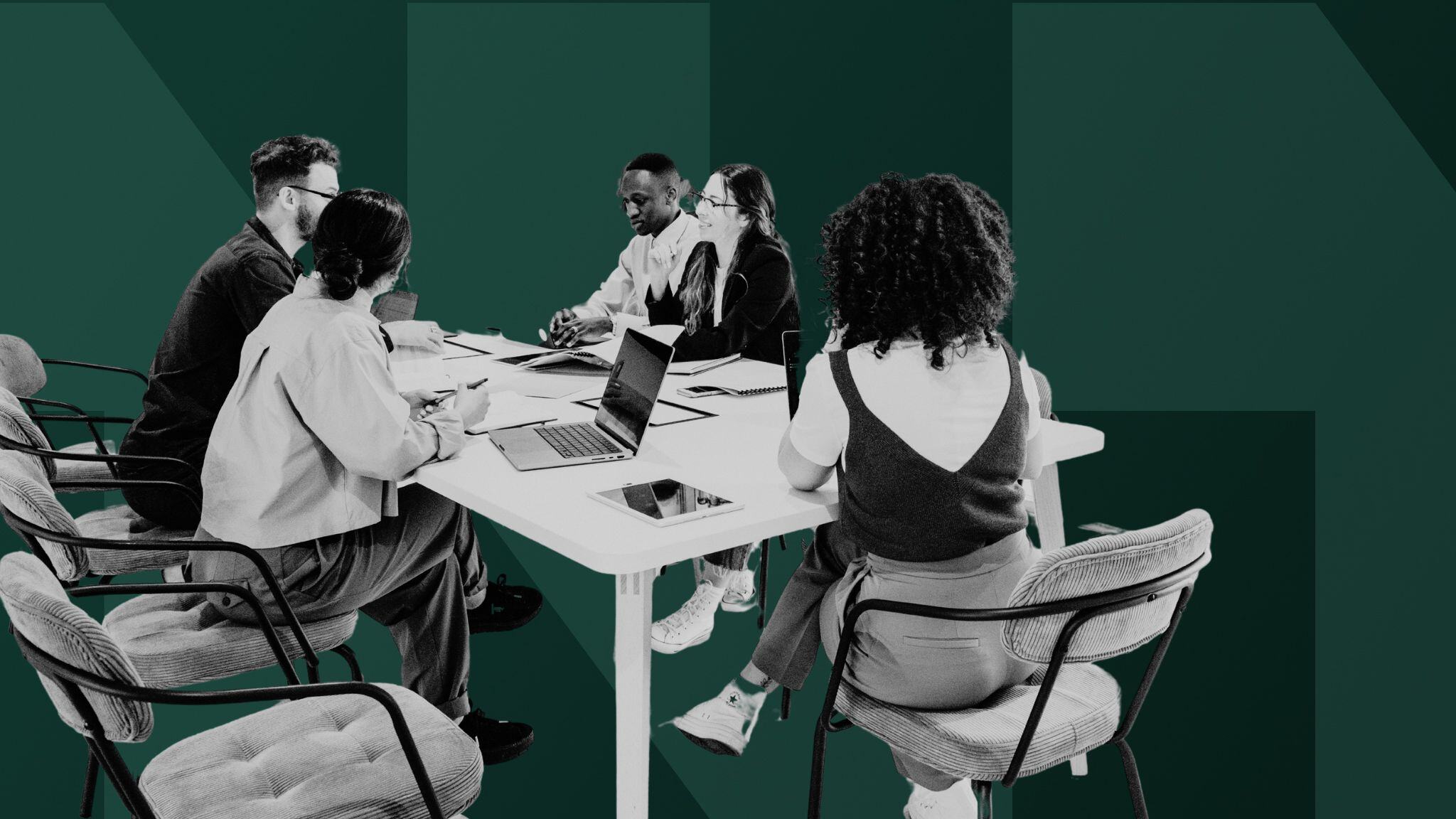 group-of-colleagues-sitting-at-desk-brainstorming